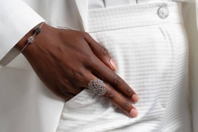 detail of model wearing adjustable ring in silver