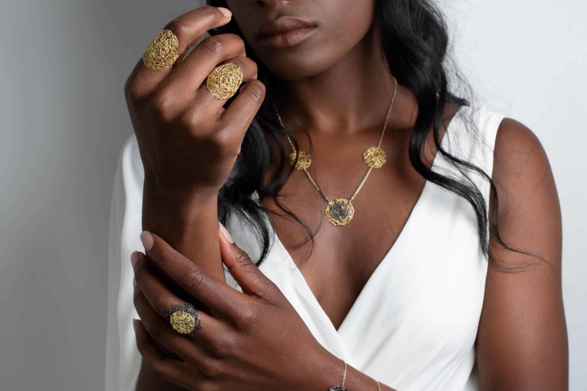 model wearing weightless gold jewelry
