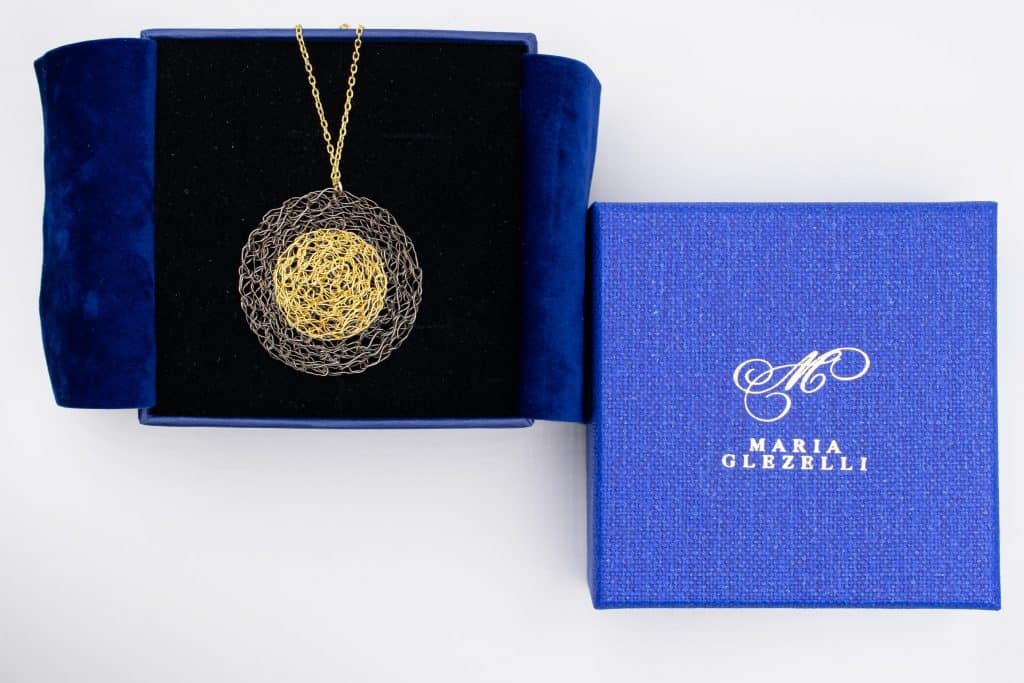 made in Italy blue box with gold necklace